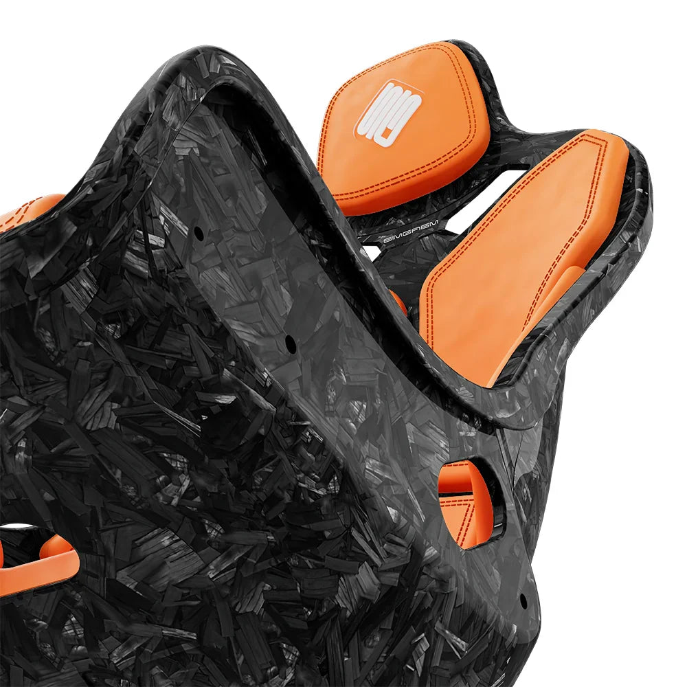 Close-up of the orange cushions and side opening on the SIMGASM Atlas Formula seat with a Forged Carbon Look shell